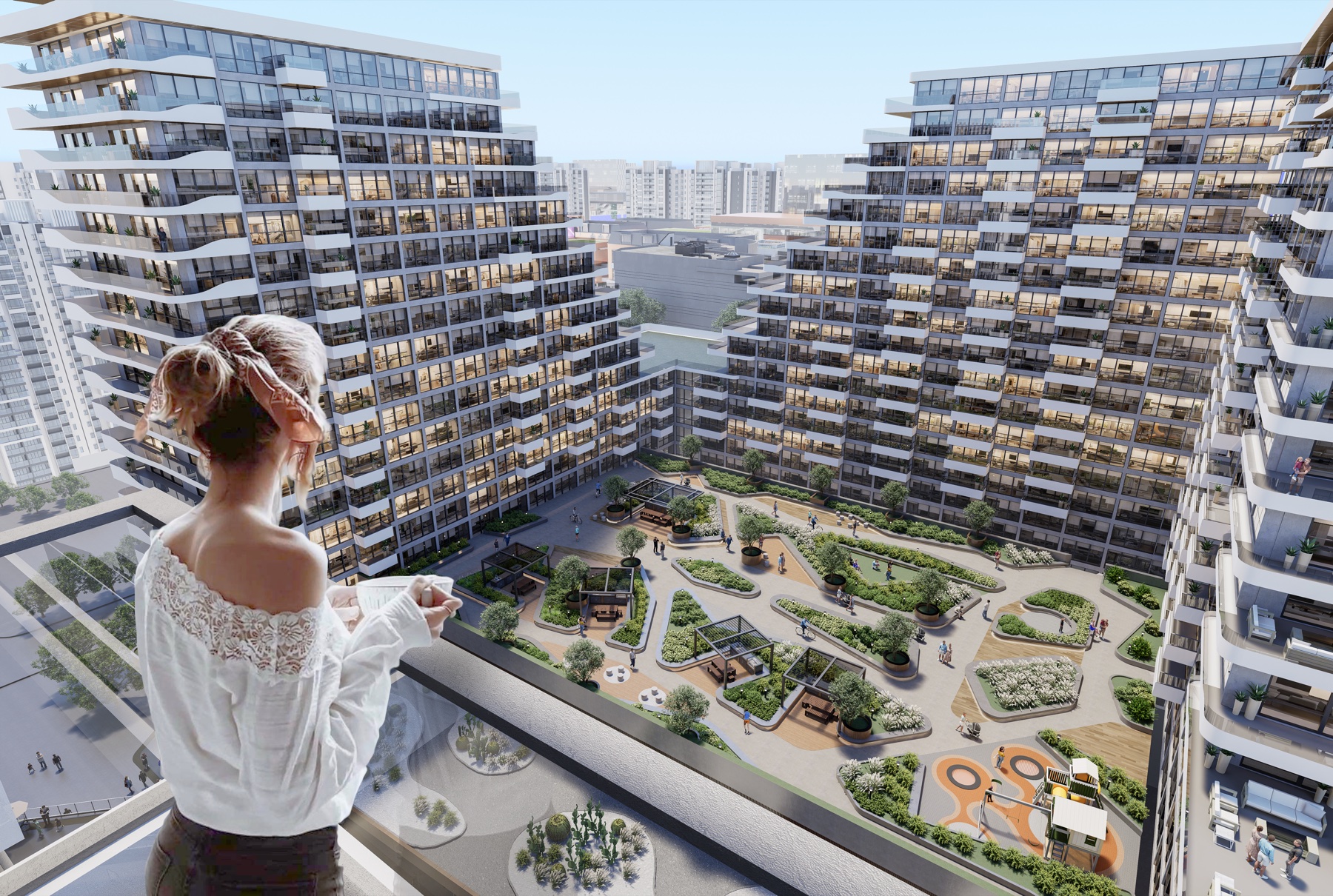 Parque interior con vegetación exuberante y senderos bajo estructura arquitectónica contemporánea